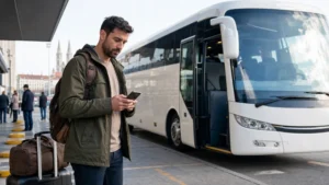 Traveller checking a phone before a Zagreb to Plitvice coach.