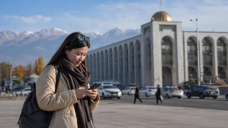Traveller using a smartphone in Kyrgyzstan for 4g kyrgyzstan tourists