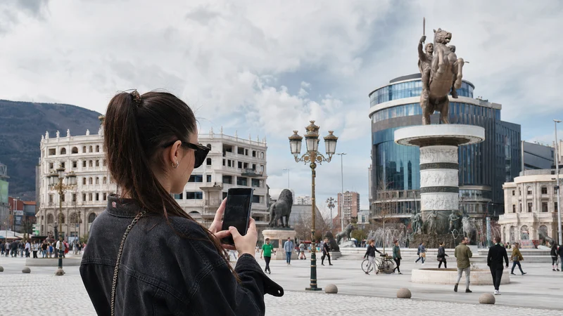 Traveller using a smartphone during 5g in north macedonia for tourists in North Macedonia.