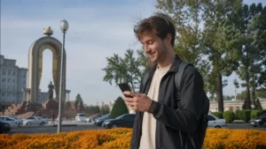 Traveller using mobile data in central Dushanbe