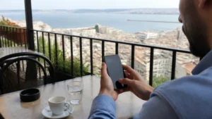 Traveller checking eSIM settings on a smartphone in Algeria