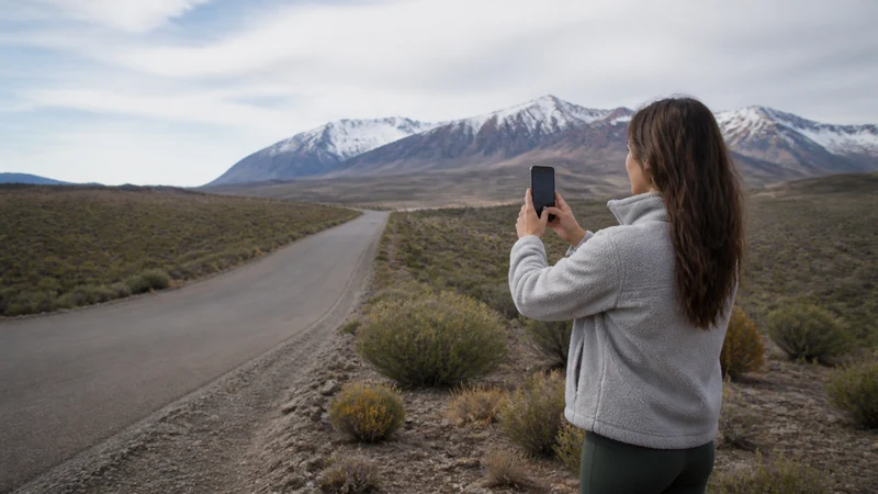 Traveller using a smartphone in Argentina for using maps and mobile data on argentina’s long-distance buses