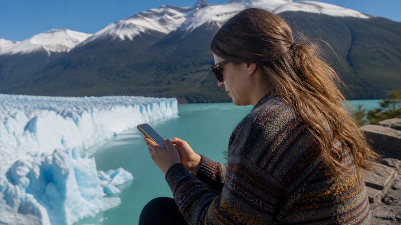 Traveller using a smartphone in Argentina for staying connected during a longer visit to argentina