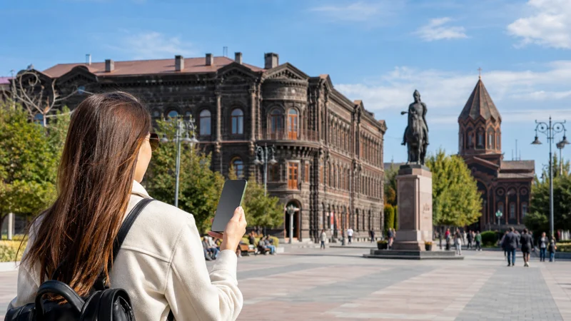 Traveller configuring using an Armenia eSIM on Android on a smartphone in Armenia