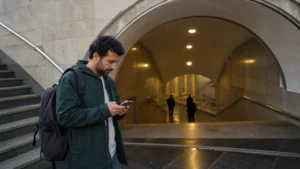 Android phone showing eSIM settings beside Baku Old City