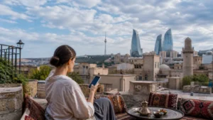 Traveller using a smartphone above Baku Old City