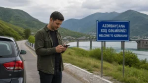 Road traveller checking mobile internet and offline maps in Azerbaijan