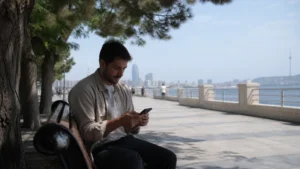 Summer traveller checking mobile data near the Caspian coast