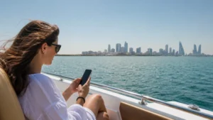 Traveller using a smartphone in Bahrain for bahrain boat trip mobile internet
