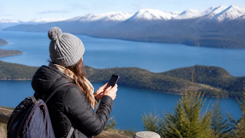 Traveller using a smartphone in Argentina for what to expect from mobile data in bariloche
