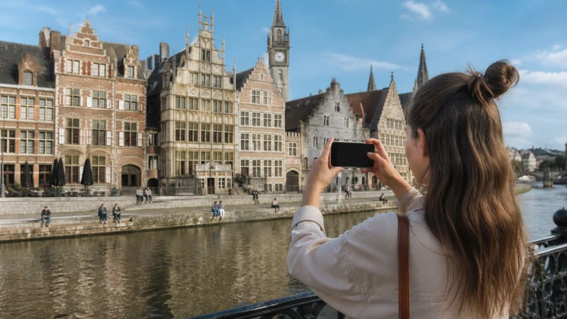 Traveller using a smartphone during a trip in Belgium