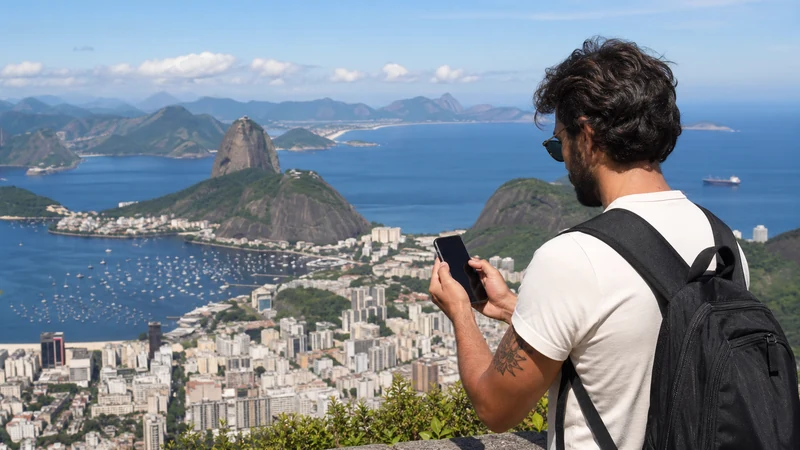 Traveller using a smartphone in Brazil for best esim brazil travel