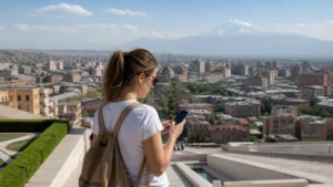 Traveller choosing an eSIM plan while overlooking Yerevan and Mount Ararat