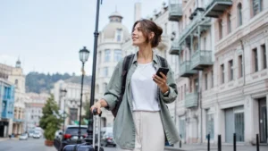 Traveller checking a smartphone on a street in Tbilisi, Georgia