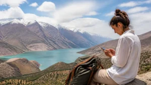 Traveller using a smartphone for best esim for tajikistan travel: how to choose