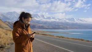 Traveller using a smartphone in Kyrgyzstan for bishkek issyk kul mobile internet