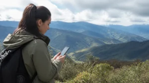Traveller using a smartphone in Colombia for internet access from bogotá to the coffee region