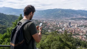 Traveller using a smartphone in Colombia for using mobile internet while staying in medellín