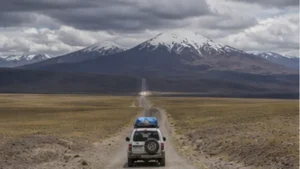 Traveller using a smartphone in Bolivia while researching mobile internet across the bolivian altiplano
