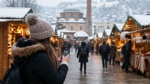Traveller using a smartphone during bosnia and herzegovina christmas markets in Bosnia and Herzegovina.