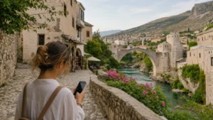 Traveller using a smartphone during bosnia and herzegovina cultural journey internet in Bosnia and Herzegovina.