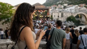 Traveller using a smartphone during bosnia and herzegovina festivals in Bosnia and Herzegovina.