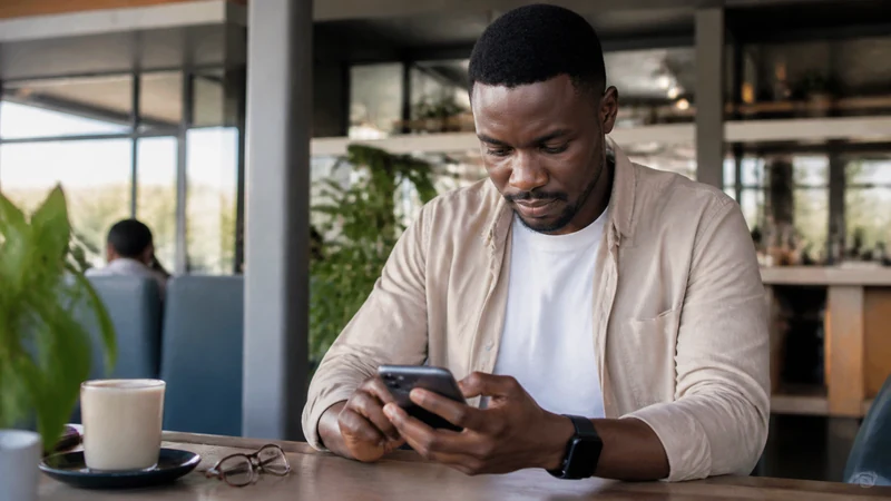 Traveller configuring an iPhone in Botswana.