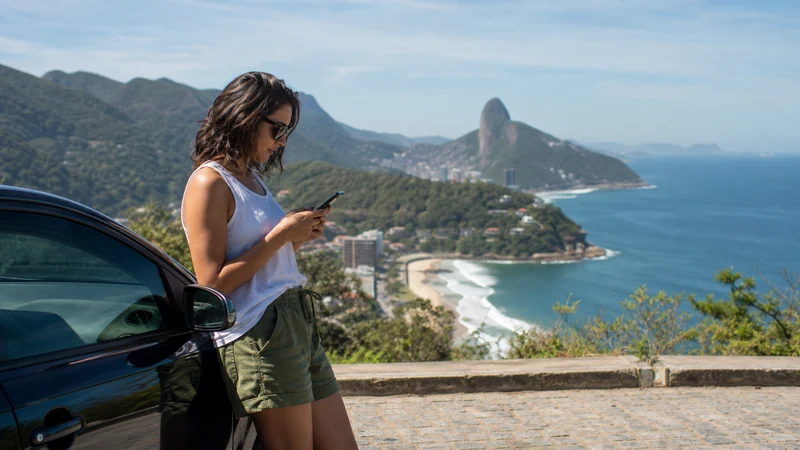 Traveller using a smartphone in Brazil for brazil road trip mobile internet