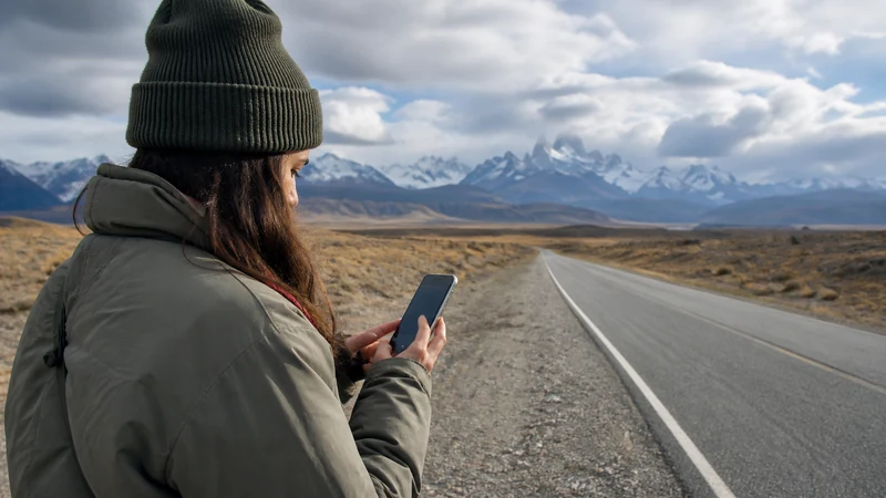 Traveller using a smartphone in Argentina for staying online from buenos aires to mendoza