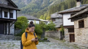 Traveller using a smartphone in a remote Bulgarian village