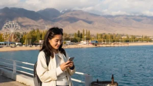 Traveller using a smartphone in Kyrgyzstan for cholpon ata mobile internet