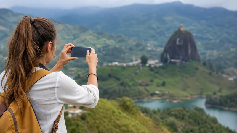 Traveller using a smartphone in Colombia for mobile internet for backpacking around colombia