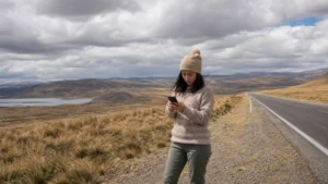 Traveller using a smartphone in Peru for cusco puno mobile internet