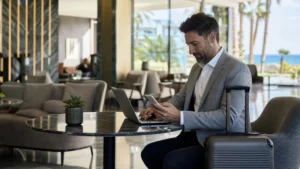 Traveller using a smartphone during cyprus business travel internet