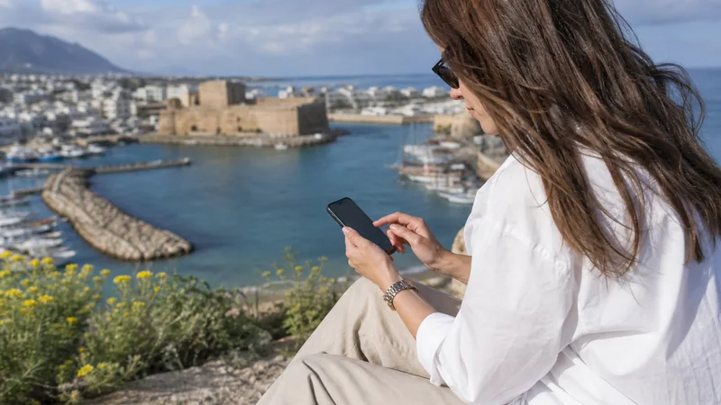 Traveller checking APN settings on a smartphone in Cyprus