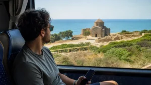 Bus traveller using a smartphone during a multi-city Cyprus trip