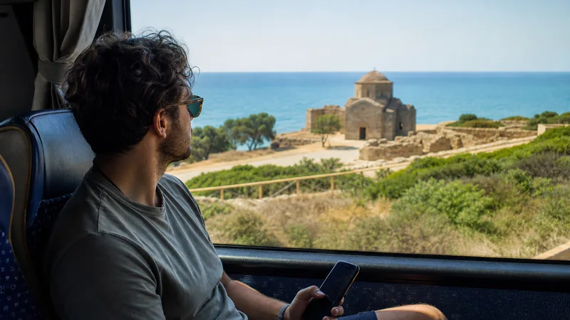 Bus traveller using a smartphone during a multi-city Cyprus trip