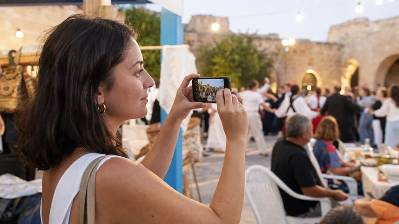 Traveller using a smartphone during cyprus festivals mobile data