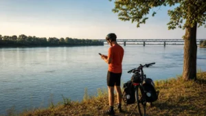 Traveller using a smartphone beside the Danube in Bulgaria