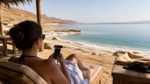 Traveller using a smartphone in Jordan for mobile internet in the dead sea: esim and business travel guide