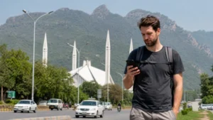 Traveller checking a smartphone in central Islamabad