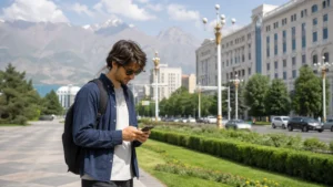 Traveller checking a smartphone on Rudaki Avenue in Dushanbe