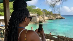 Traveller using a smartphone in Jamaica while using WhatsApp in Jamaica