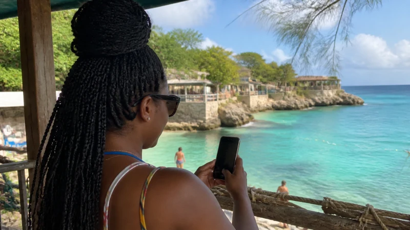Traveller using a smartphone in Jamaica while using WhatsApp in Jamaica