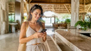 Traveller using a smartphone in the Dominican Republic for dominican republic esim dual sim