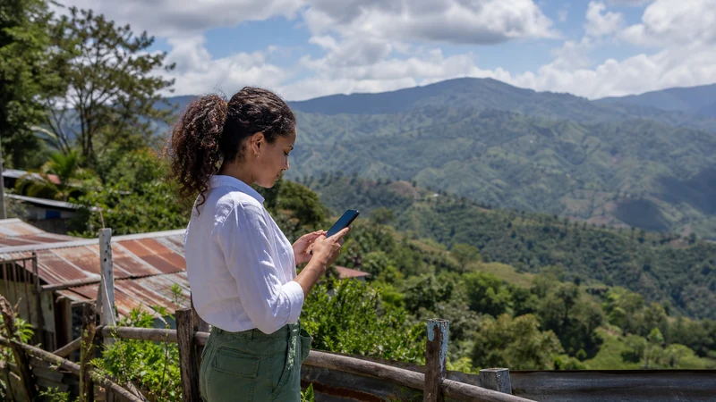 Traveller using a smartphone in the Dominican Republic for dominican republic mountain mobile internet