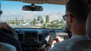 Traveller using a smartphone for dushanbe airport to city mobile internet and transfer connectivity