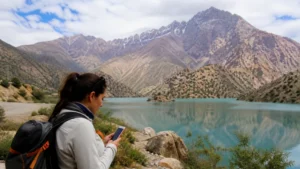 Traveller using a smartphone for dushanbe to seven lakes mobile internet and esim guide