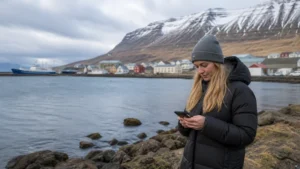 Traveller using a smartphone in the Eastfjords