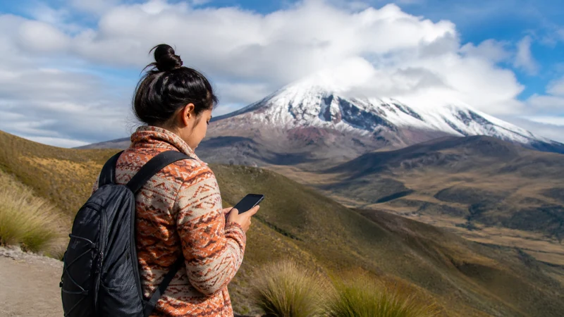 Traveller using a smartphone in Ecuador for ecuador andes mobile internet